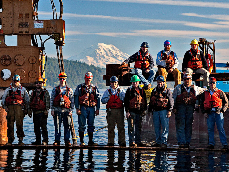AAC Workers standing over water